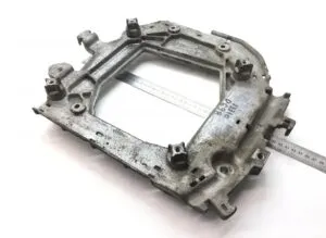 Scania engine support 2377040 – rectangular metal piece with multiple fixings
