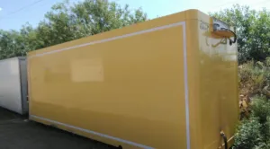 Yellow cargo box for scania truck