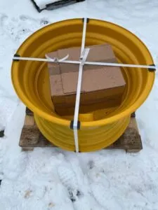 Wheel for caterpillar 980g front loader – new, yellow, on wooden pallet